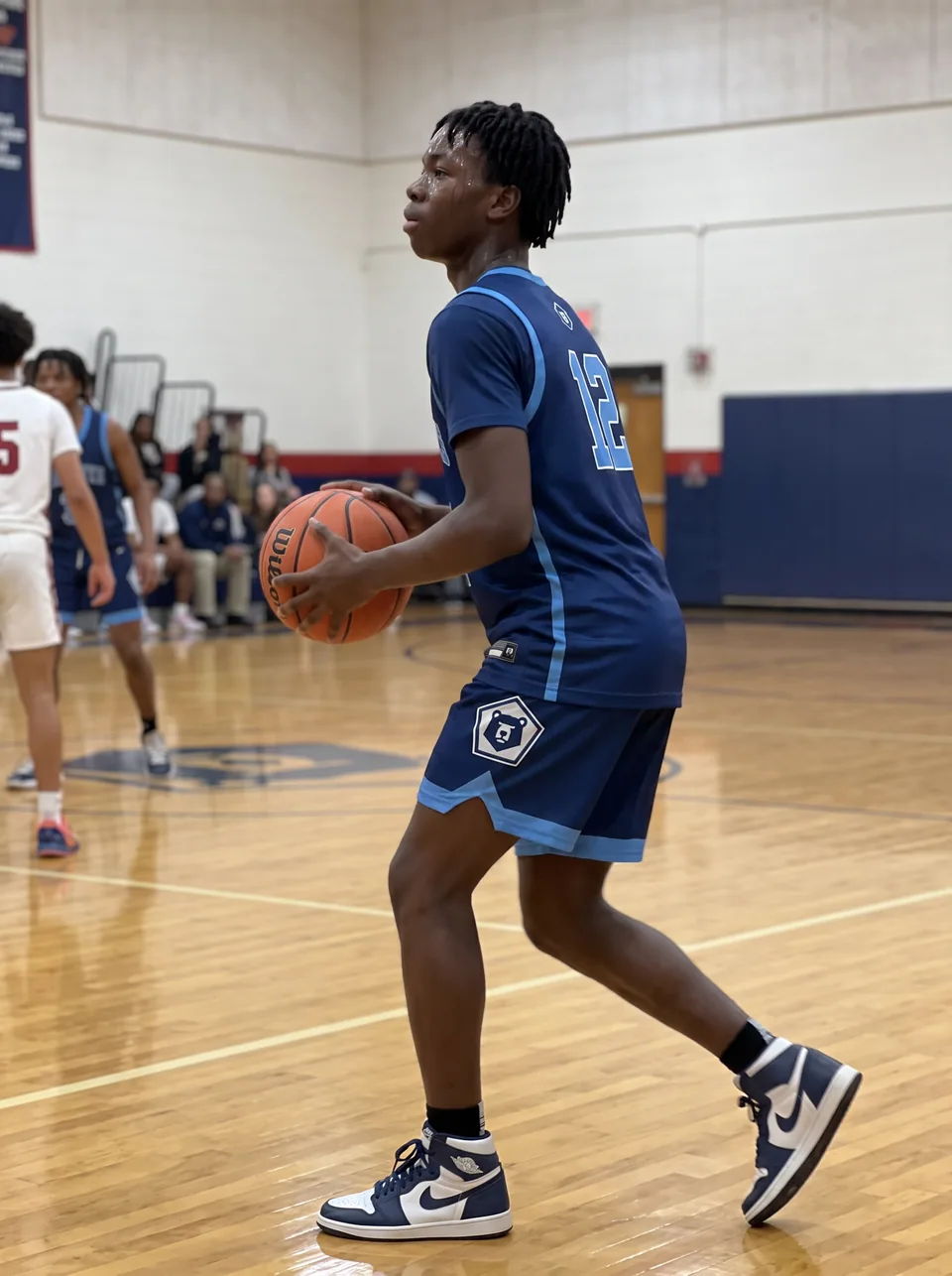 One of the phone photos a parent sent: a fictional basketball player in the gym, in the jersey the card shows; photo generated